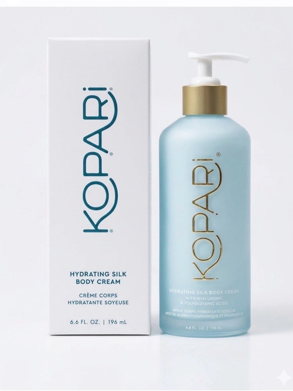 Kopari Hydrating Silk Body Cream — Pale Blue Bottle with Gold Pump